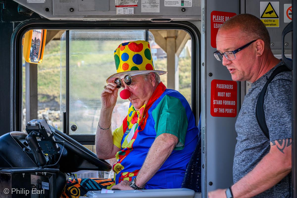 He Drives the Bus Like a Clown by Philip Earl